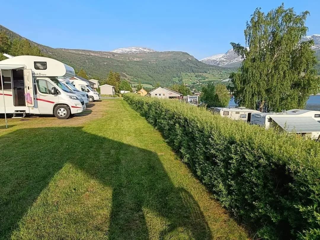 Caravan and motorhome pitches with mountain backdrop