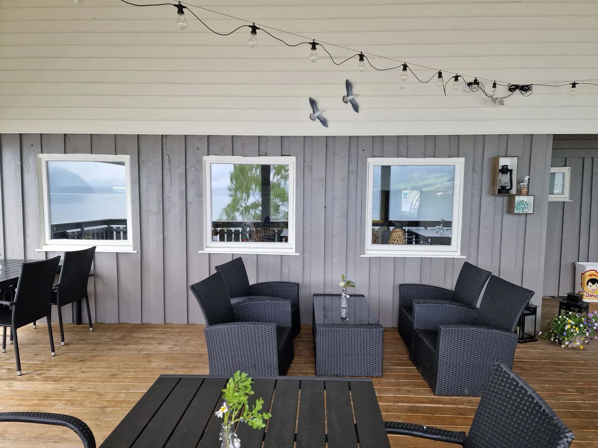 Cozy restaurant corner with windows overlooking the fjord
